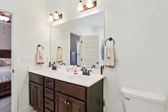 a bathroom with a tub a window and a shower