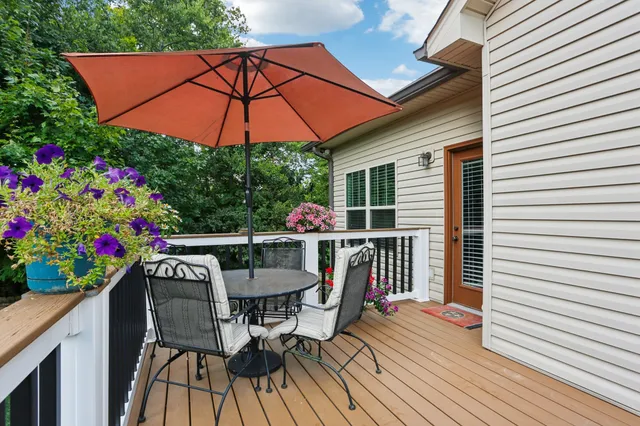 a view of a back yard with a deck