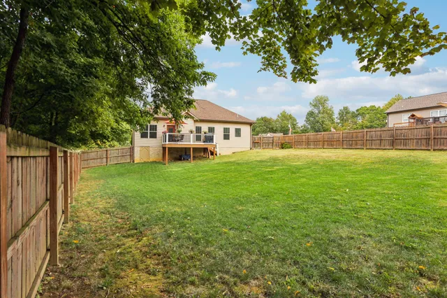 an aerial view of residential house with outdoor space