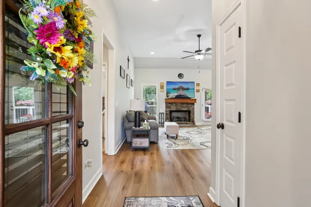 a living room with furniture and a potted plant