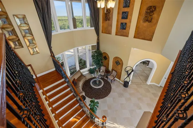 a bathroom with a granite countertop sink mirror vanity and toilet