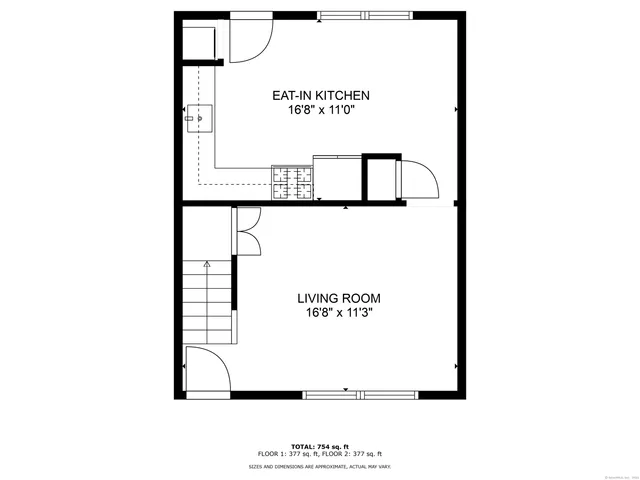 a bedroom with two beds and a chandelier