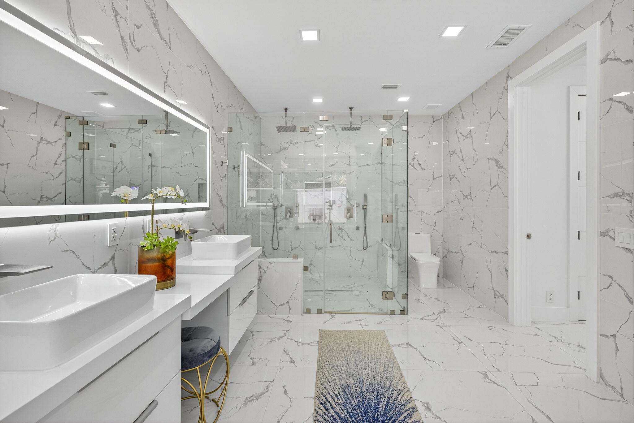 2673 Northwest 64th Boulevard Boca Raton, FL 33496 - Photo 29 of 64 a bathroom with a sink a toilet and shower