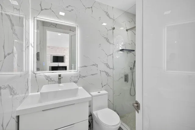 a view of a patio with table and chairs