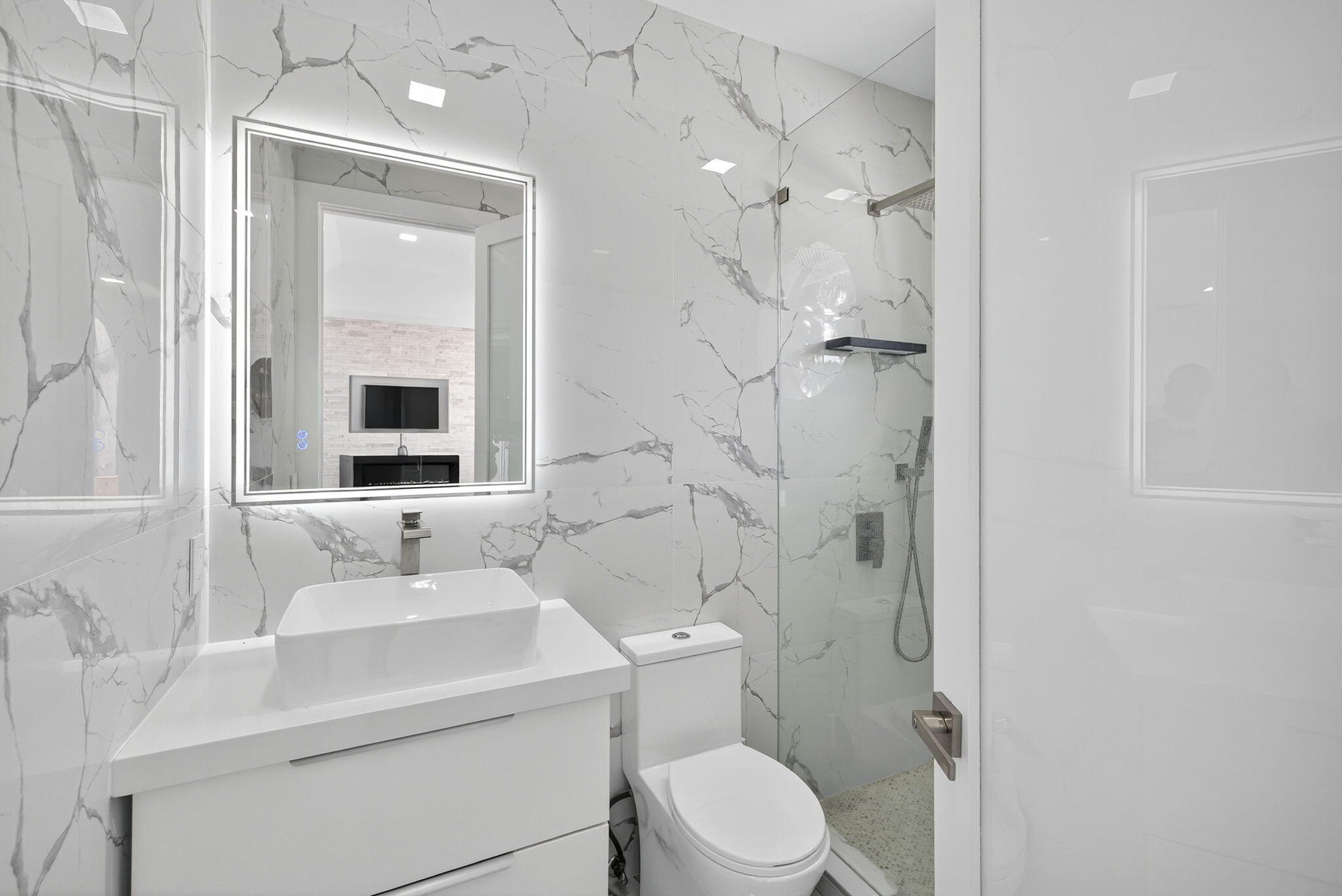 2673 Northwest 64th Boulevard Boca Raton, FL 33496 - Photo 41 of 64 a bathroom with a sink toilet and shower