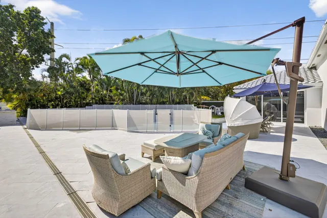 an aerial view of a house with a garden and trees