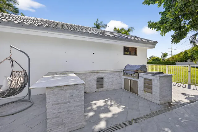 a view of swimming pool with outdoor seating and plants