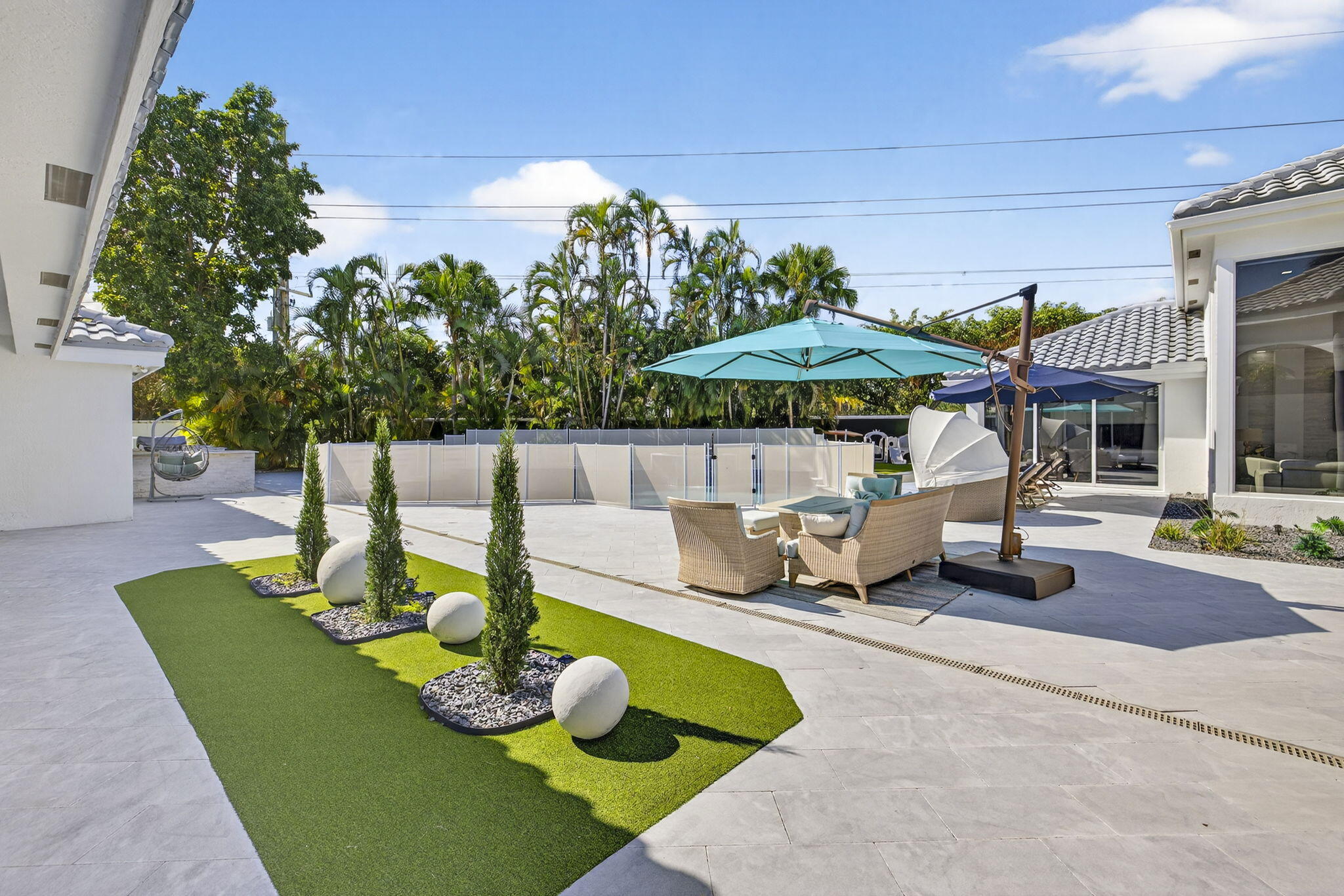 2673 Northwest 64th Boulevard Boca Raton, FL 33496 - Photo 5 of 64 a view of a swimming pool with a patio