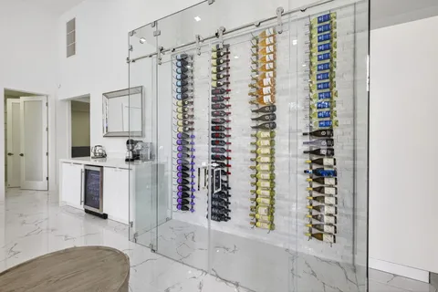 a view of kitchen with window and refrigerator