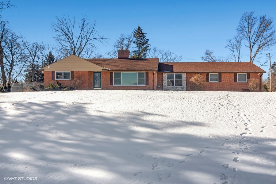 a front view of a house with yard