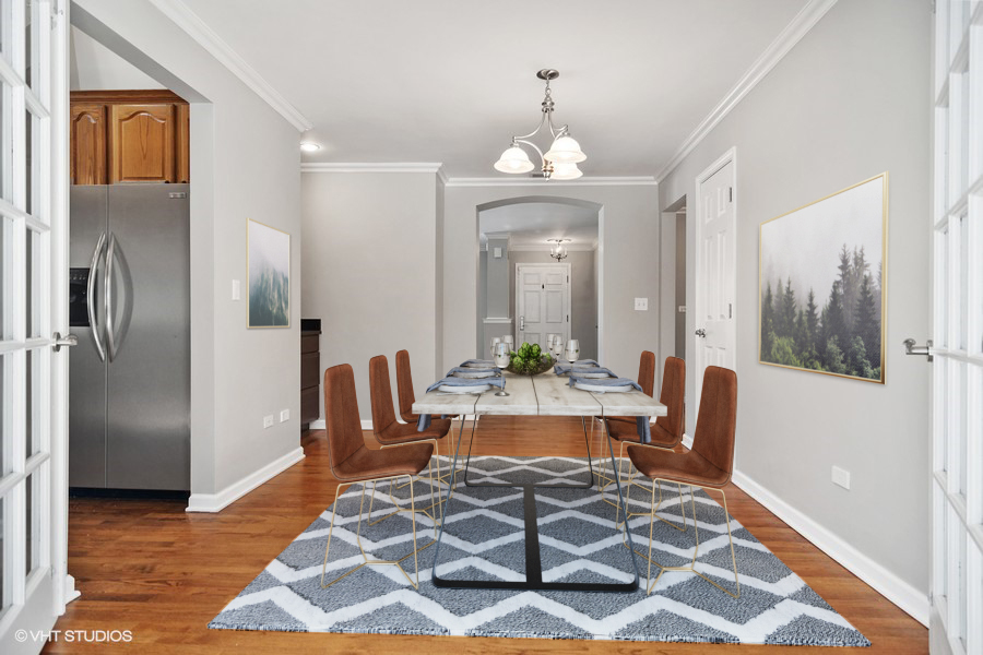 831 Ela Road Inverness, IL 60067 - Photo 3 of 25 a living room with furniture a dining table and a chandelier