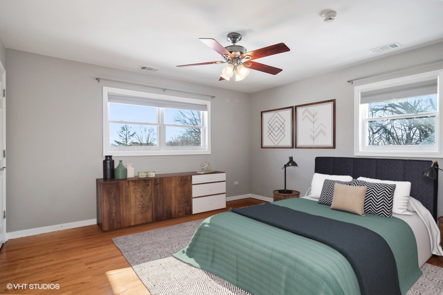 831 Ela Road Inverness, IL 60067 - Photo 8 of 25 a bedroom with a bed and a chandelier