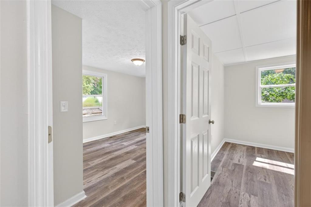 136 Nowell Street Monroe, GA 30655 - Photo 21 of 25 a view of a hallway with wooden floor and a room