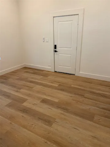 a view of a small space with wooden floor