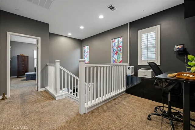 a view of a livingroom with furniture and windows