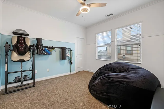 a bedroom with a bed and cabinets