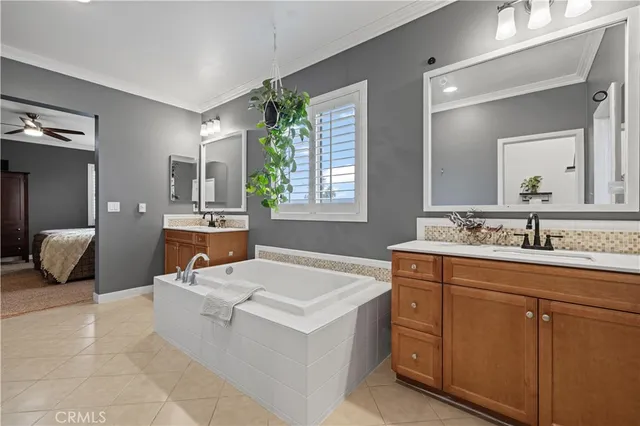 a spacious bedroom with a bed a window and couch