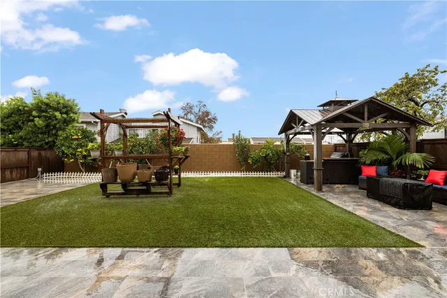 a view of a backyard with sitting area