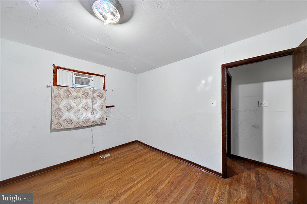185 Smith Road Mineral, VA 23117 - Photo 12 of 26 an empty room with wooden floor and windows