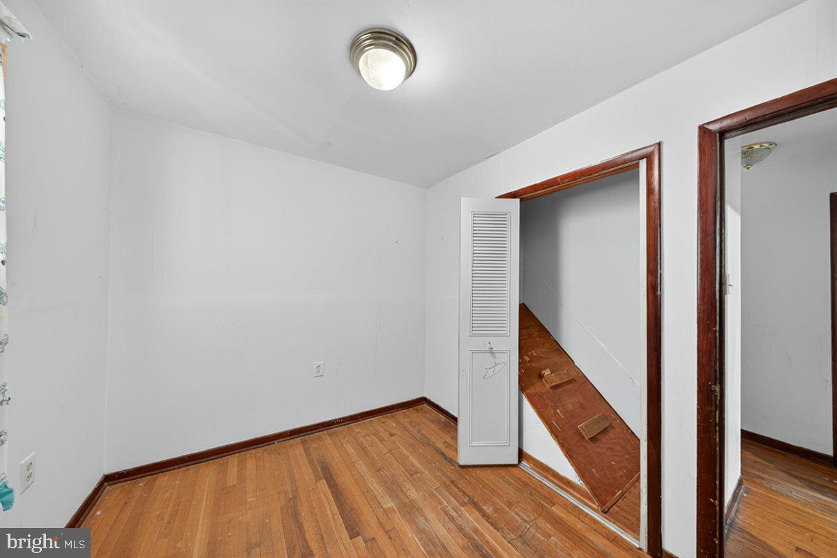 185 Smith Road Mineral, VA 23117 - Photo 14 of 26 a view of a hallway with wooden floor and staircase