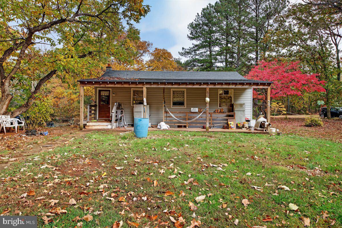185 Smith Road Mineral, VA 23117 - Photo 21 of 26 a view of a house with backyard sitting area and garden