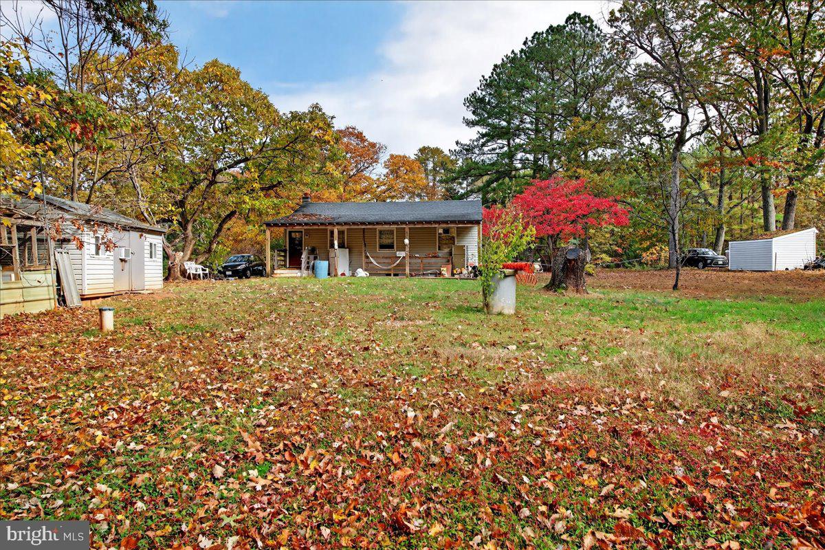 185 Smith Road Mineral, VA 23117 - Photo 22 of 26 a front view of a house with a yard