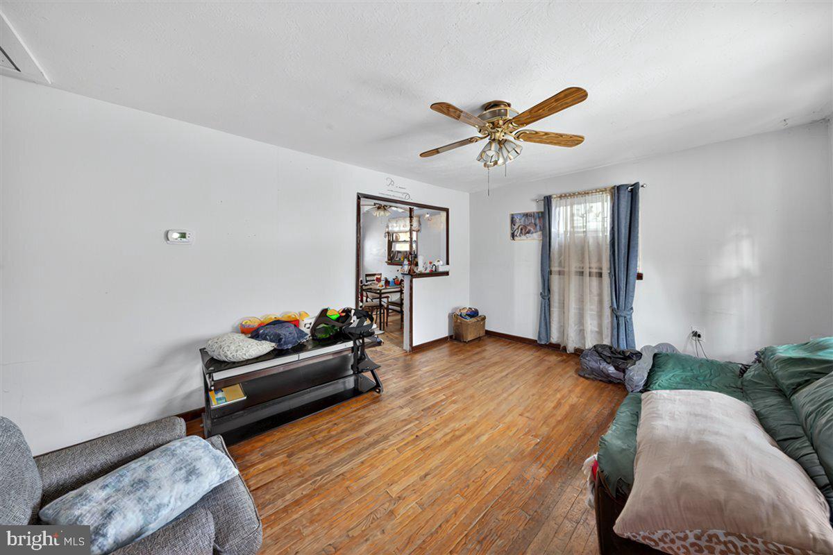 185 Smith Road Mineral, VA 23117 - Photo 4 of 26 a living room with furniture and a wooden floor