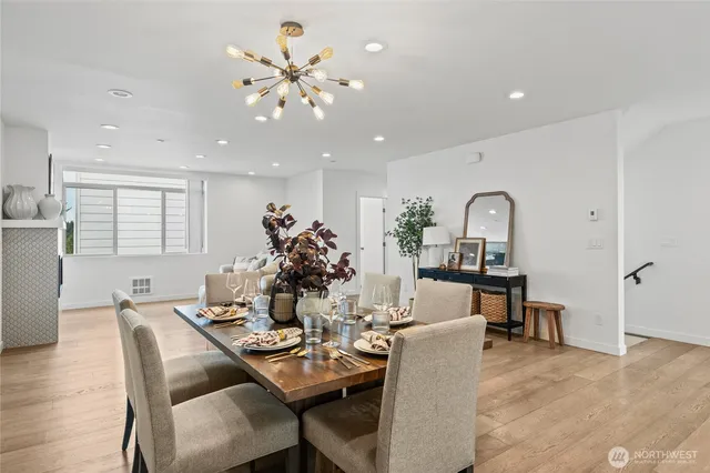 a view of a dining room with furniture and wooden floor