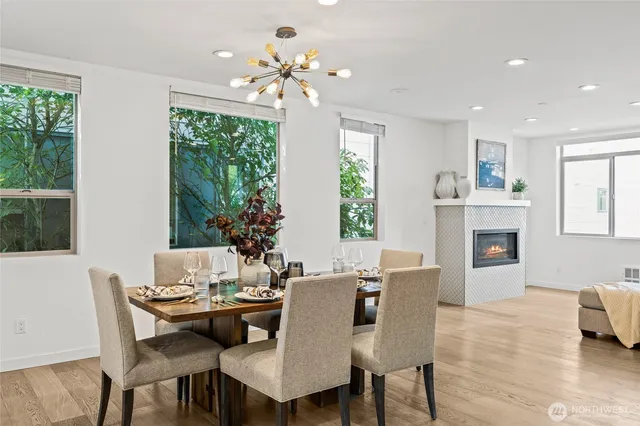 a view of a dining room with furniture window and wooden floor