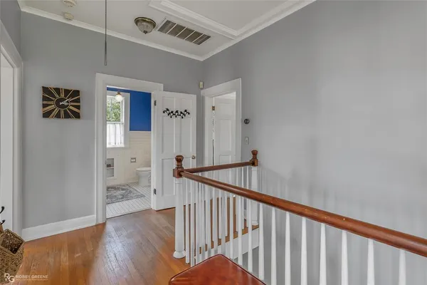 a view of hallway with wooden floor