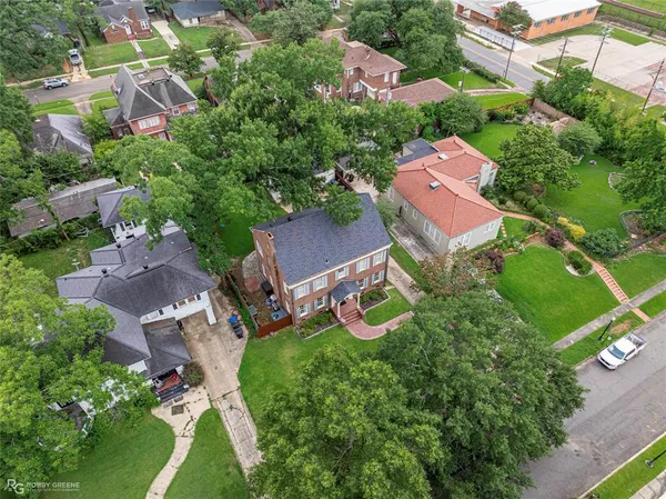an aerial view of a house with a garden