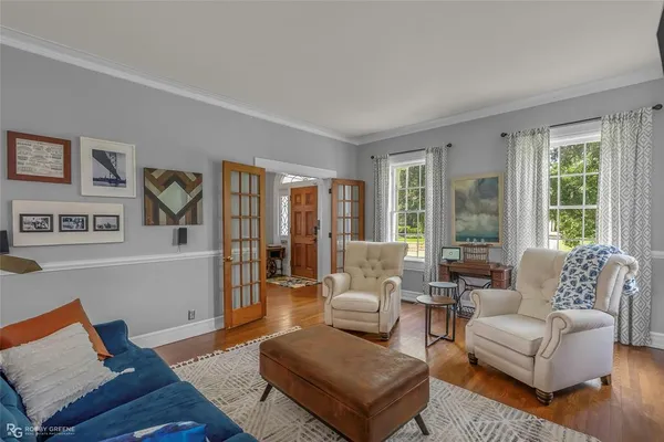 a living room with furniture and large window