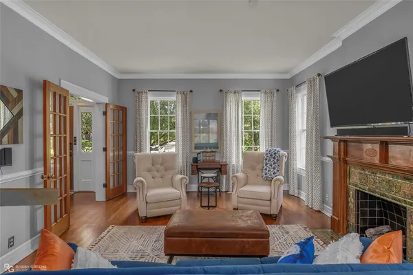 a living room with fireplace furniture and a flat screen tv