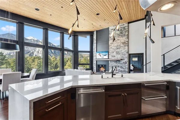 a kitchen with a sink and large cabinets