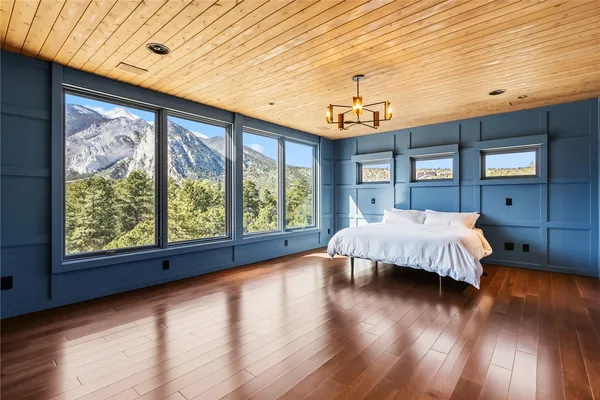 a bedroom with a large window