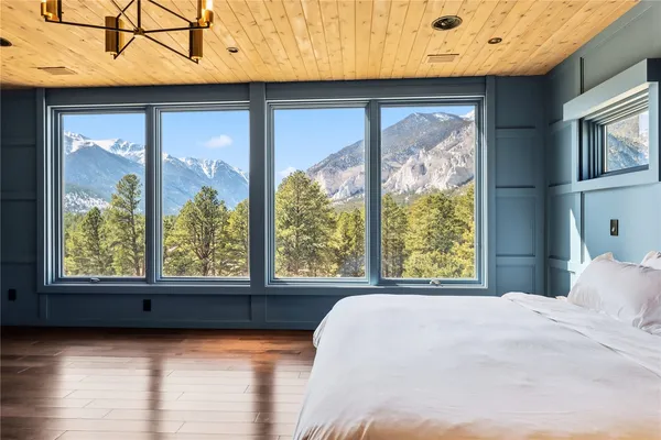a bathroom with a granite countertop sink and a large mirror