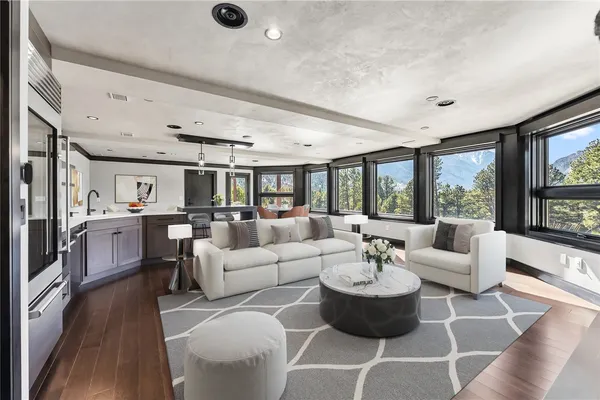 a living room with fireplace furniture and a flat screen tv