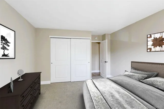 a bedroom with a bed and a couch