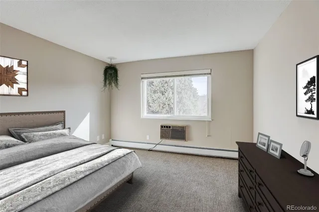 a bedroom with a bed and a table