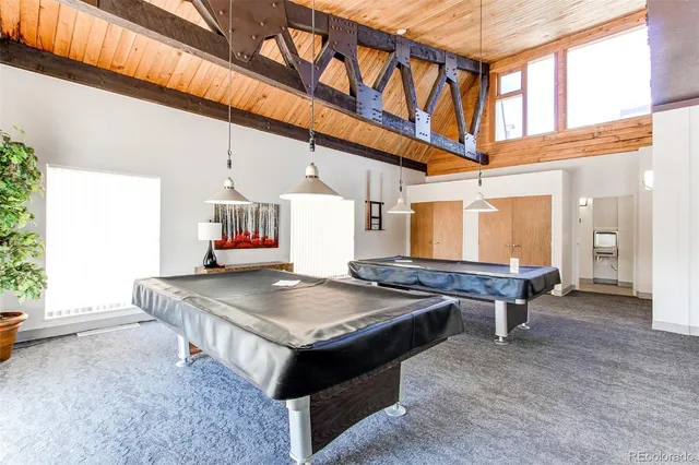 a living room with furniture a rug and a large window