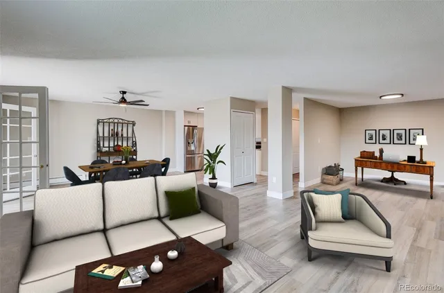 a living room with furniture and wooden floor