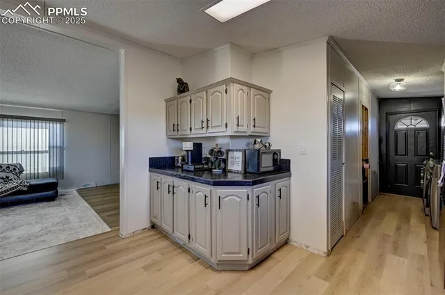 a kitchen with stainless steel appliances granite countertop a sink and cabinets