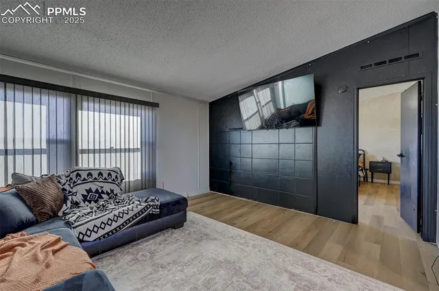 a spacious bedroom with a large bed and a couch