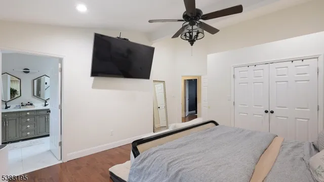 a bed room with a bed and a potted plant