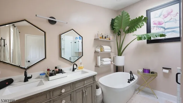 a bathroom with a bathtub and a shower