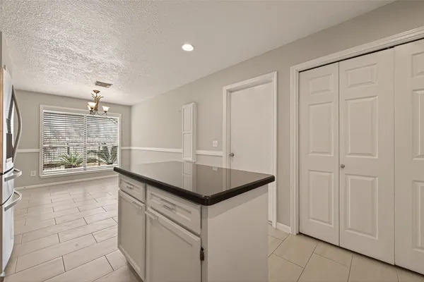 a kitchen that has a sink and a stove in it