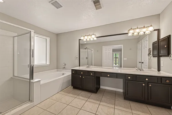 a bathroom with a bathtub and a shower