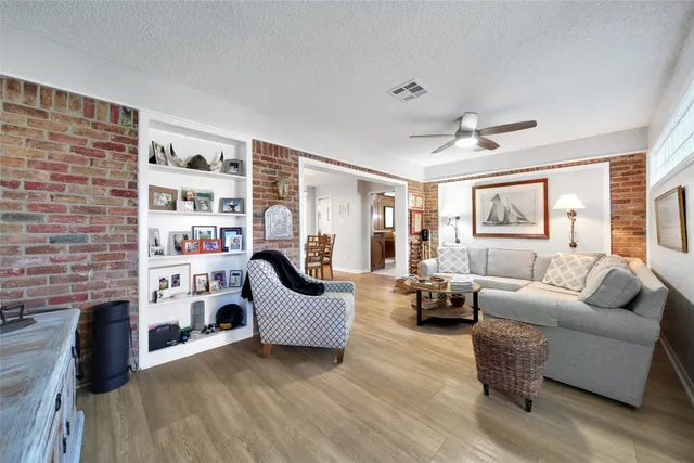 a living room with furniture or couch and a fireplace