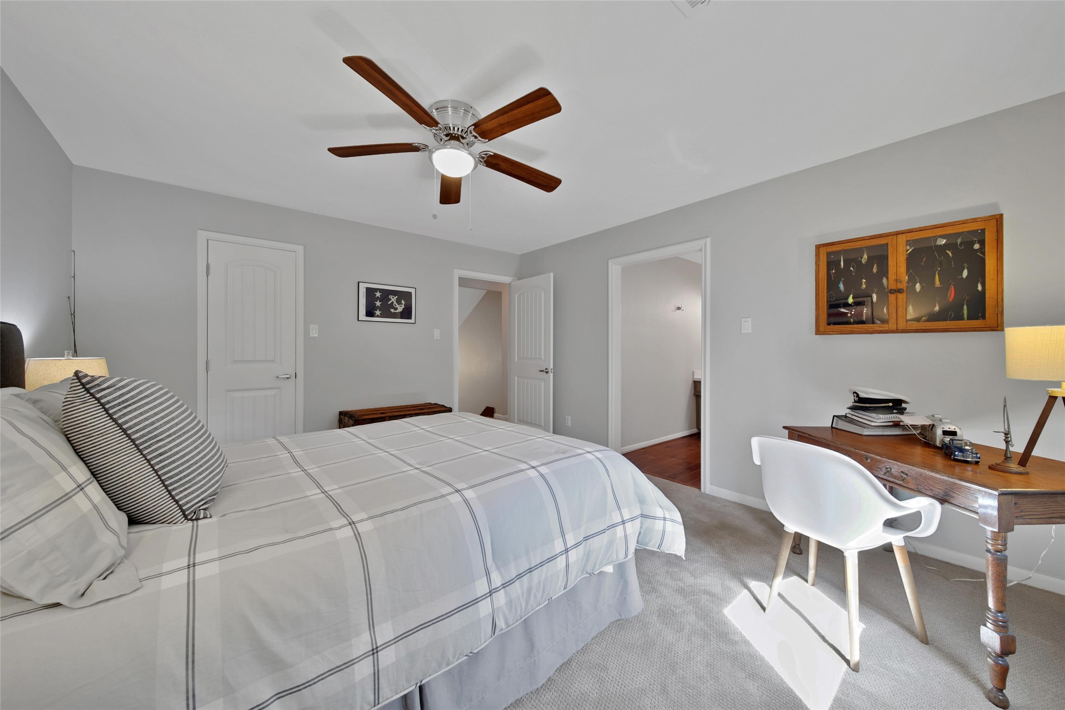 2902 Blue Lakes Lane Missouri City, TX 77459 - Photo 19 of 34 a bedroom with a bed and a chandelier