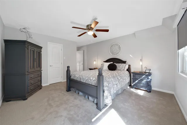 a bed room with a bed and a window